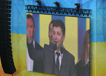 Kyiv, Ukraine - April 19, 2019: Face of candidate Volodymyr Zelensky seen on the big TV-screen at the stage of NSC Olimpiyskiy stadium in Kyiv during the Presidential Debate with Petro Poroshenkoのeditorial素材