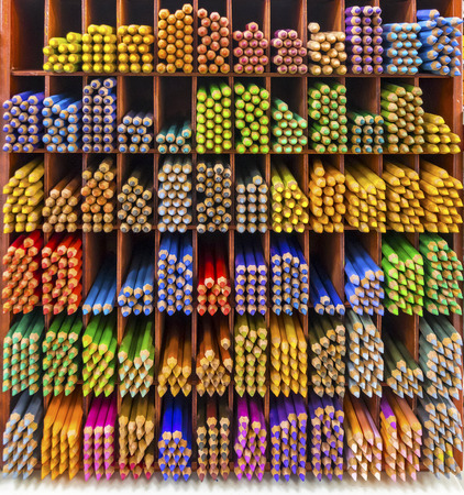 Colourful watercolor pencils on the shelvesの写真素材