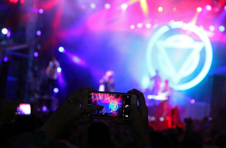 Kyiv, Ukraine - July 8, 2018: Fans take a picture of British alternative post hardcore rock band Enter Shikari live performance at the Atlas Weekend Music Festival in National Expocenter in Kyivのeditorial素材