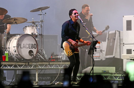 Kyiv, Ukraine - July 8, 2018: Placebo, a British alternative rock band and Brian Molko, lead singer and frontman performs live at the Atlas Weekend Music Festival in National Expocenter in Kyivのeditorial素材