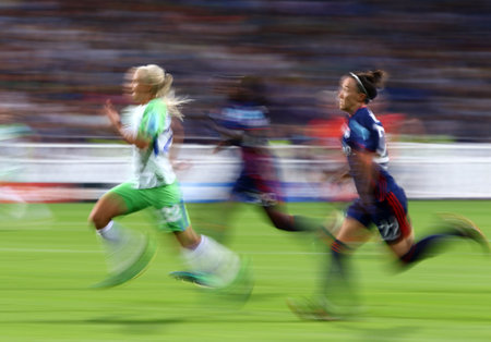 KYIV, UKRAINE - MAY 24, 2018: Pernille Harder of VFL Wolfsburg (L), Griedge MBock Bathy (C) and Lucy Bronze (both of Olympique Lyonnais) run during their UEFA Women's Champions League Final 2018 gameのeditorial素材