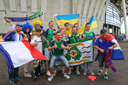 LYON, FRANCE - JUNE 16, 2016: Ukrainian and Northern Irish fans pose for a group photo before the UEFA EURO 2016 game Ukraine v Northern Ireland at Stade de Lyon stadium in Lyon, Franceのeditorial素材