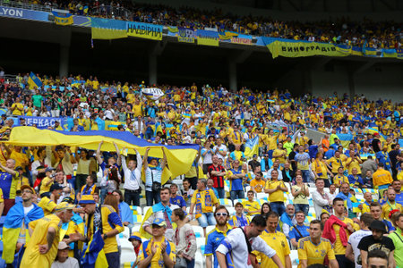 LYON, FRANCE - JUNE 16, 2016: Ukrainian fans show their support during the UEFA EURO 2016 game Ukraine v Northern Ireland at Stade de Lyon stadium in Lyon, Franceのeditorial素材