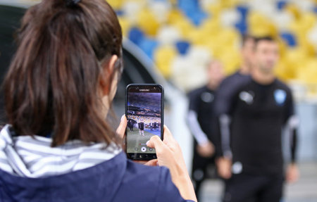 KYIV, UKRAINE - September 18, 2019: Journalist records a video on her smartphone while Malmoe...