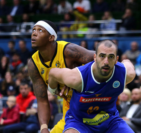 KYIV, UKRAINE - SEPTEMBER 20, 2019: Kyndahl Hill of BC Kyiv Basket (L) and Marino Sarlija of Kapfenberg Bulls fights for a rebound during their FIBA Basketball Champions League Qualifiers game in Kyivのeditorial素材