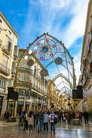 Malaga, Spain - December 10, 2017: People walking on Calle Marques de Larios street, decorated with Christmas decorations. Most popular pedestrian street in Malaga city, Andalusia, Spainのeditorial素材