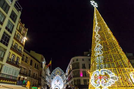 Malaga, Spain - December 9, 2017: Decorated Christmas Tree on Plaza de la Constitucion square in center of Malaga city, Andalusia, Spainのeditorial素材