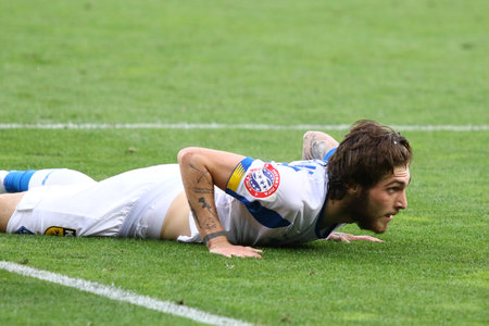 KYIV, UKRAINE - JULY 4, 2020: Georgii Tsytaishvili of FC Dynamo Kyiv lies on the grass during the Ukrainian Premier League game against Shakhtar Donetsk at NSC Olimpiyskiy stadium in Kyiv, Ukraineのeditorial素材