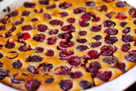 Homemade baked cherry clafoutis. Close-up cherry pie