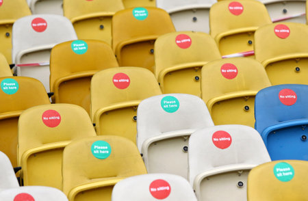 KYIV, UKRAINE - AUGUST 5, 2020: Seats with Covid-19 quarantine labels seen on the tribunes of NSC Olimpiyskyi stadium in Kyiv during the UEFA Europa League game Shakhtar Donetsk v VfL Wolfsburgのeditorial素材