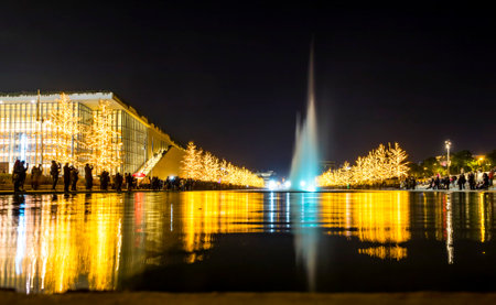 Athens, Greece - December 15, 2019: Night view of colourful dancing water fountain event at Stavros Niarchos Foundation Cultural Center (SNFCC) in Athens. Christmas decorationsのeditorial素材