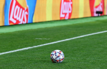 KYIV, UKRAINE - OCTOBER 27, 2020: Official UEFA League match ball on the grass seen during UEFA League game Shakhtar v Inter in Kyiv. Lays advertisement on backgroundのeditorial素材