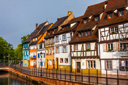 Colmar, France - May 2019: Colourful traditional half-timbered houses on the Quai de la Poissonnerie (The Fishmonger's Quay), thoroughfare on Lauch river in the old town of Colmar city, Alsaceのeditorial素材
