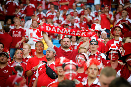 LVIV, UKRAINE - JUNE 17, 2012: Danish football supporters show their support during the UEFA EURO 2012 game Germany v Denmark at Lviv Arena in Lvivのeditorial素材