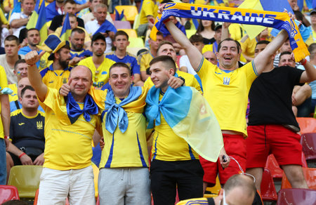 BUCHAREST, ROMANIA - JUNE 21, 2021: Ukrainian fans show their support during the UEFA EURO 2020 game Ukraine v Austria at National Arena Bucharest stadiumのeditorial素材