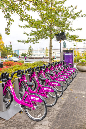 Reykjavik, Iceland - September 5, 2017: Row of bicycles on the docking station of WOW Air public bike-sharing system on the streets of Reykjavik city. Wow citybikeのeditorial素材
