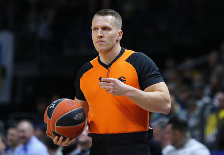 Berlin, Germany - April 4, 2024: Basketball referee Kristaps KONSTANTINOVS (Greece) in action during...