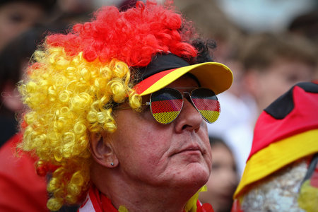 Berlin, Germany - July 5, 2024: Emotions of German football fans seen at the Fan zone at the Brandenburg Gate in Berlin during the UEFA EURO 2024 quarter-final game Spain v Germanyのeditorial素材