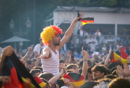 Berlin, Germany - July 5, 2024: German supporters show their support at the Fan zone at the Brandenburg Gate in Berlin during the UEFA EURO 2024 quarter-final football game Spain v Germanyのeditorial素材