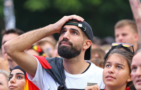 Berlin, Germany - July 5, 2024: Emotions of German football fans seen at the Fan zone at the Brandenburg Gate in Berlin during the UEFA EURO 2024 quarter-final game Spain v Germanyのeditorial素材