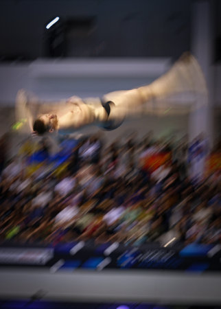 Berlin, Germany - March 24, 2024: Lars RUDIGER of Germany performs during Men's 3m Springboard Final of the World Aquatics Diving World Cup 2024 in Berlin. Photo with panning effectのeditorial素材