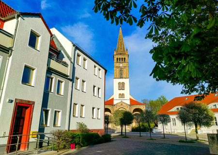 Historic St. Nicholas Church (St.-Nicolai-Kirche) and buildings on Boetzower Platz in Oranienburg,...