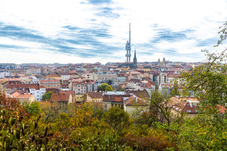 Autumn panoramic view of Prague old town with colorful historic buildings and Zizkov Television Tower on a horizon. Skyline of Prague, Czechiaの写真素材