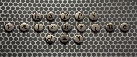 Happy valentines day with letters on metal ribbon with silverの写真素材
