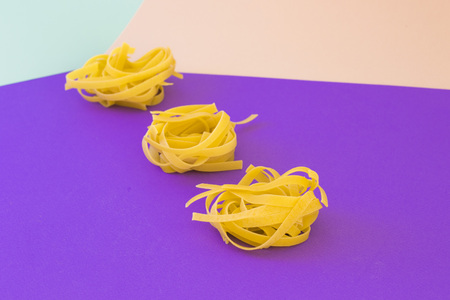 Set of spaghetti on bright violet backgroundの写真素材