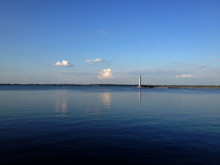 Calm sea and lighthouse. Full calm of the sea and the view of the lighthouseの写真素材