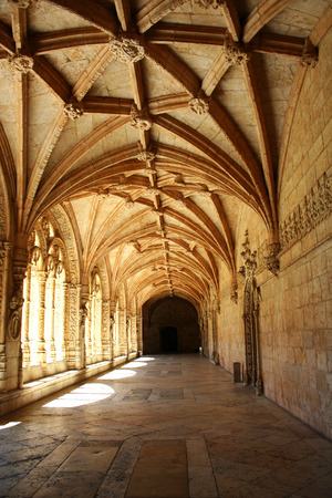 Carved arched corridor in monastery. The carved arched corridor in the monastery of Jeronimos in Lisbon, Portugal Mosteiro dos Jeronimosのeditorial素材