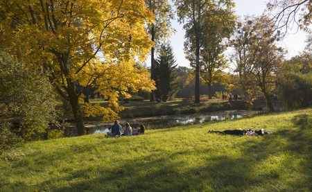 People enjoy a warm autumn day in the Alexandria Park. Bila Tserkva, Kyiv region of Ukraine.のeditorial素材