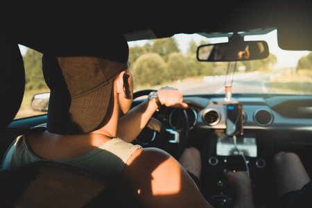 A young sports guy is driving. Travel and freedom concept