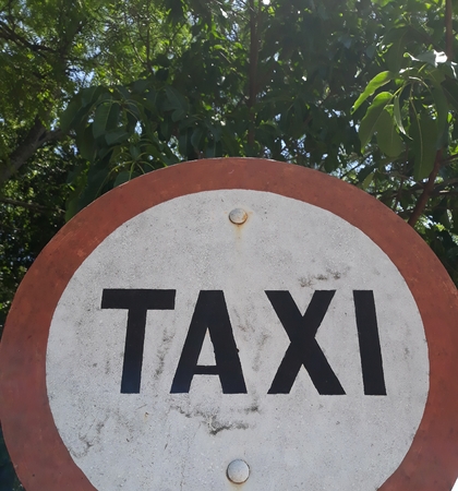 taxi sign parking sign on a beautiful day in natureの写真素材