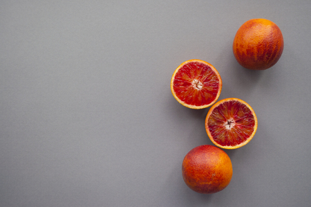 Blood orange on purple background.の写真素材