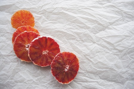 Cut juicy blood oranges on white background with text space.の写真素材