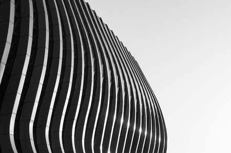 Contemporary geometric facade of a building with wavy lines in black and white.の写真素材