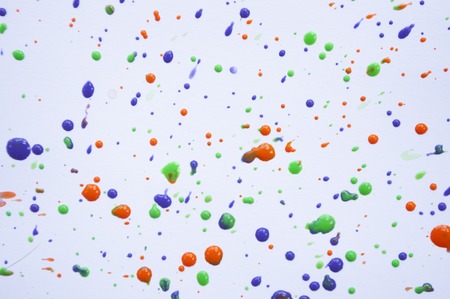 Colorful violet, green and orange watercolor splashes on white background for your design.の写真素材