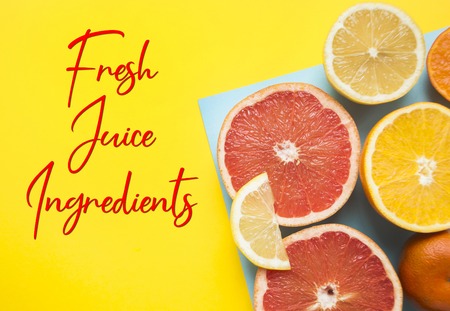 Flat lay of cut ripe juicy grapefruit, lemon and orange on yellow and blue background. Citrus pattern.の写真素材