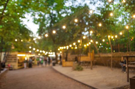 Beautiful bokeh background of the festival in the green city park.の写真素材