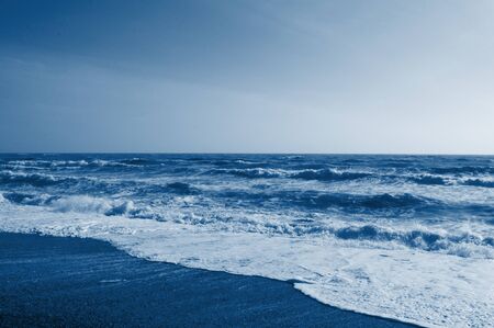 Color trend 2020. Surface of sea water colored by sunset light.
