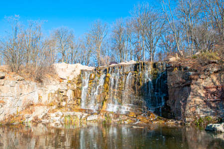 Beautiful waterfall cascade on a sunny autumn day in a national park.の写真素材
