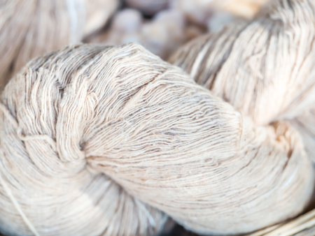 Closeup of raw twisted thread or silk for handmade textileの写真素材