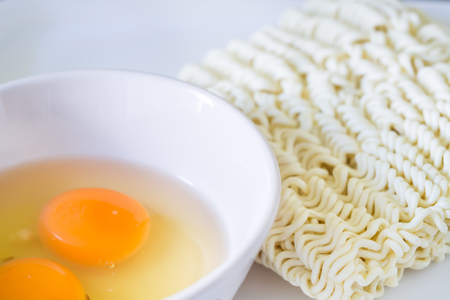 Preparation for cooking instant noodles and eggs.の写真素材
