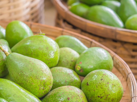 Closeup of avocado in the basket in the market.の写真素材