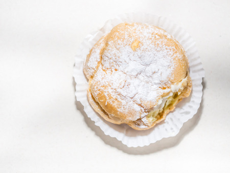 Top view and closeup of Choux Cream on paper background