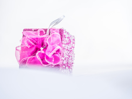 Pink gift box on gentle fabrics backgroundの写真素材