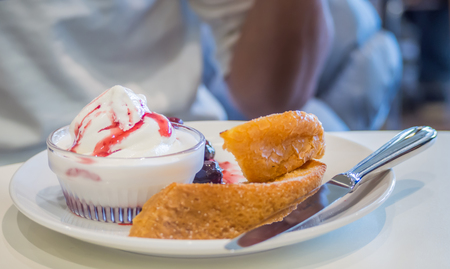 Closeup of sweet bakery and plate on the tableの写真素材