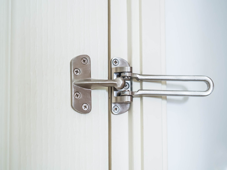 Closeup of the unlocked swing door guard. Security or safety concepts.