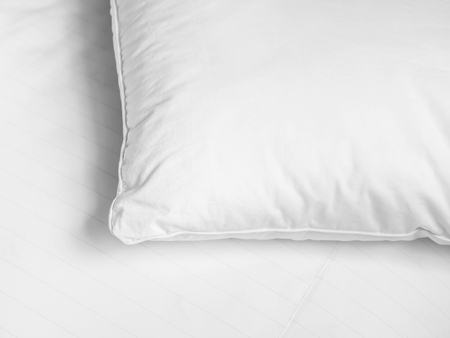 Black and white tone. White pillow on the bed in the bedroom.の写真素材